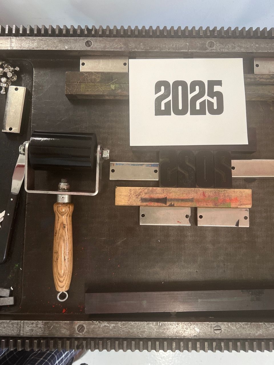 Picture of a print ink roller and 2025 printed